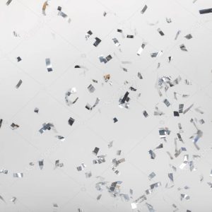 Falling silver confetti pieces