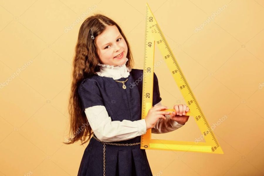 STEM school disciplines. Pupil girl with big ruler. small girl back to school. School student learning geometry. math lesson. Education and knowledge. Enjoying student life