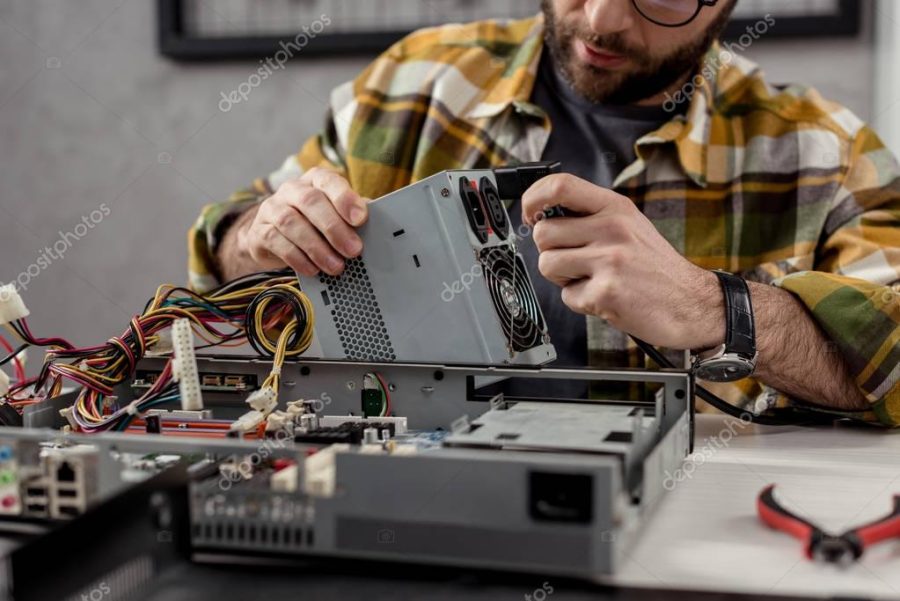 cropped image of fixing broken computer part