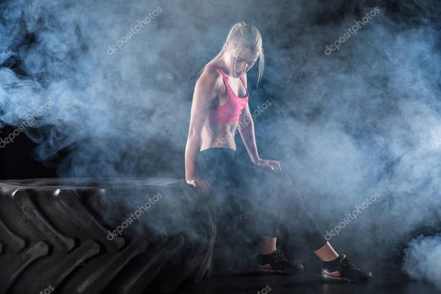 woman sitting on tire