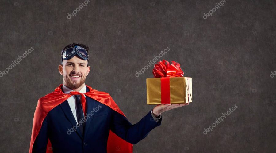 A man in a superhero costume with a gift box.