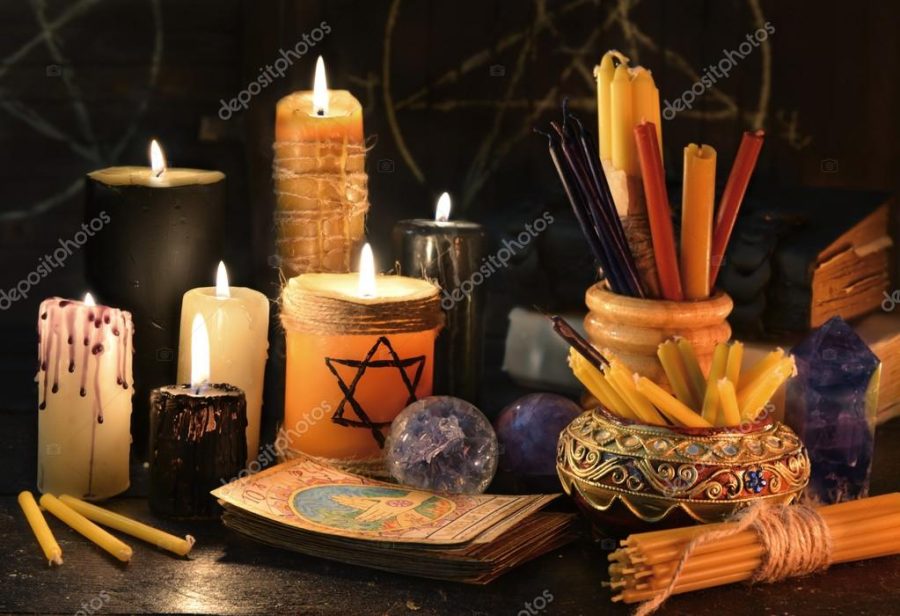Candles, witch books and tarot cards