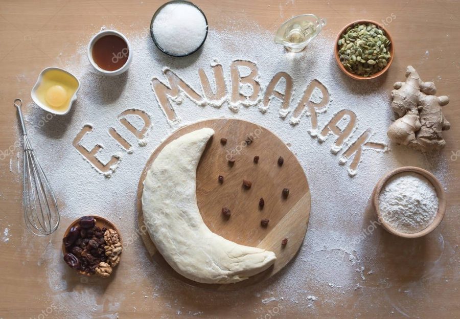 Eid Mubarak - Islamic holiday welcome phrase " happy holiday", greeting reserved. Arabic cuisine background.