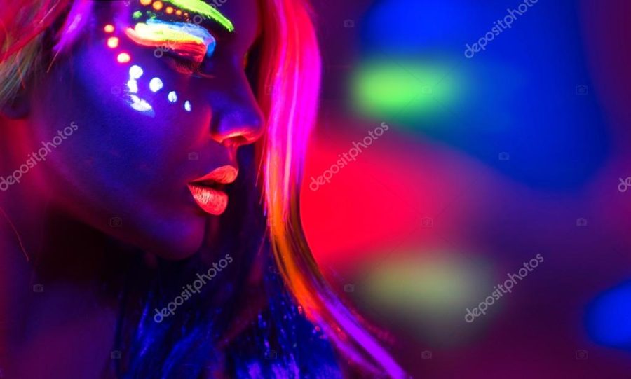 Fashion model woman in neon light