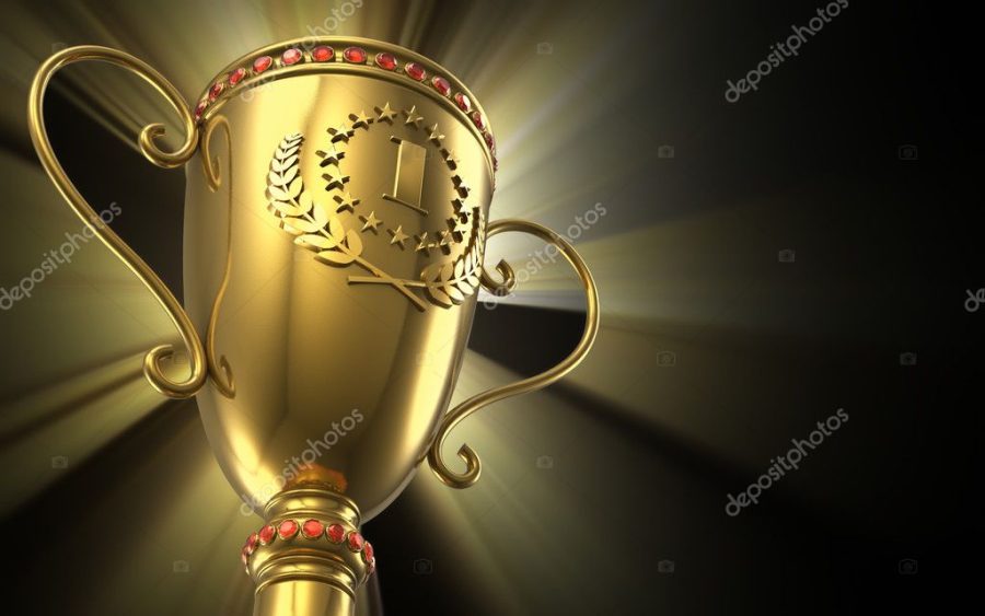 Golden glowing trophy cup on black background