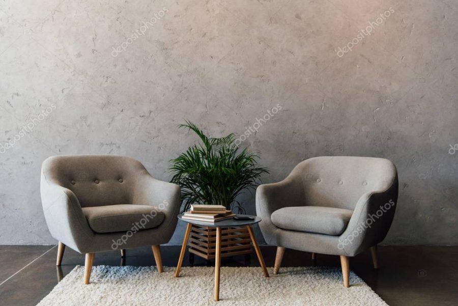 Grey armchairs on carpet