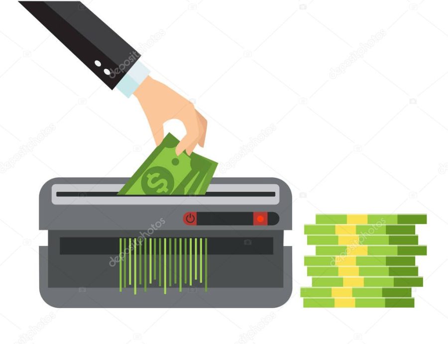 Hand putting paper money in shredder machine. Dollar termination concept. Many bundle of US dollars bank notes isolated on white background. Man's hand in a suit destroys, cuts money.