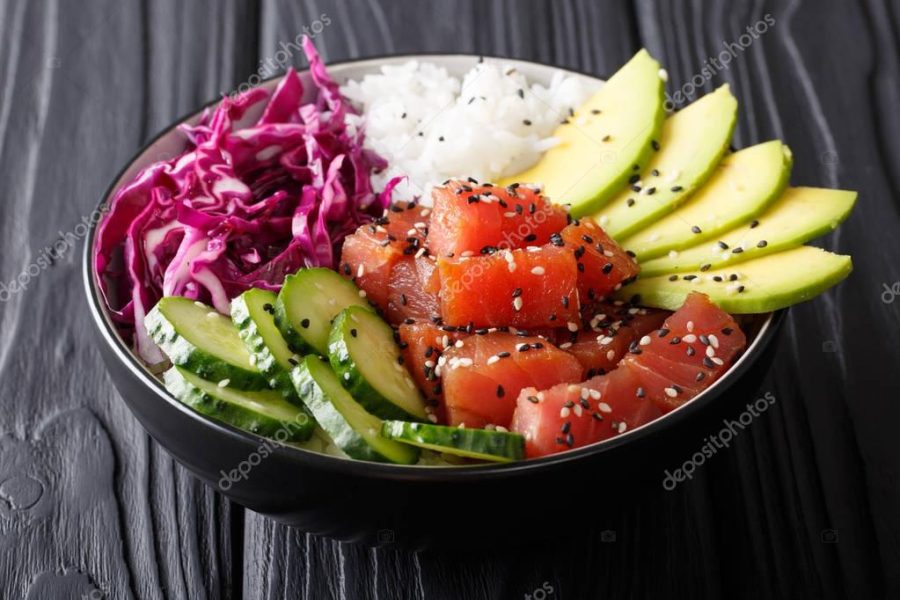 Organic food: tuna poke bowl with rice, fresh cucumbers, red cab
