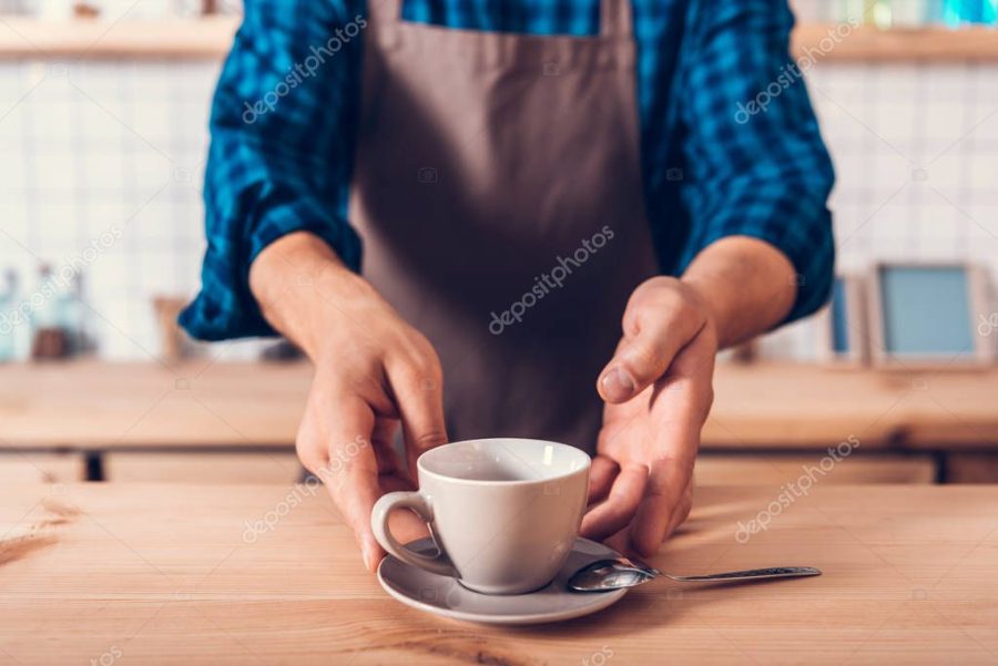 barista with cup of coffee