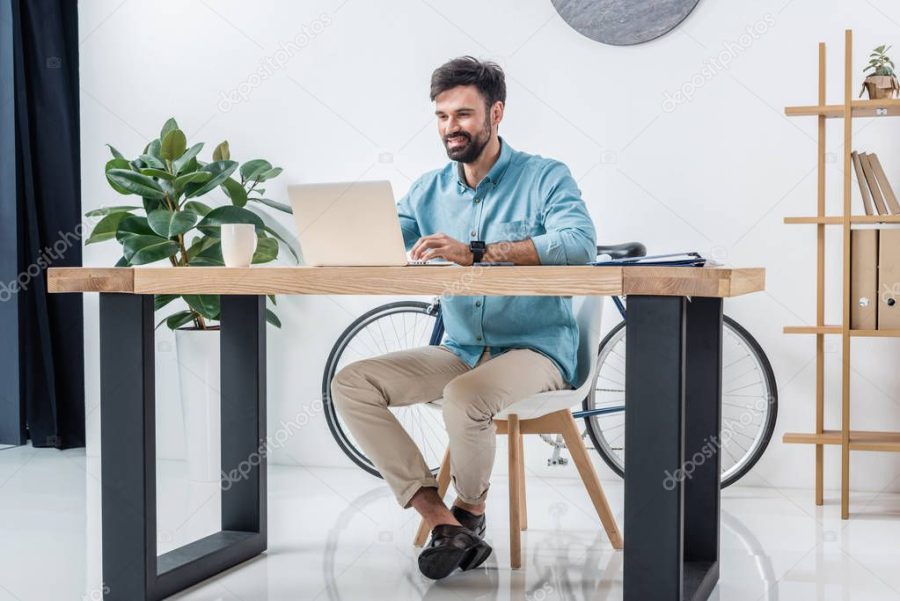 businessman with laptop at workplace