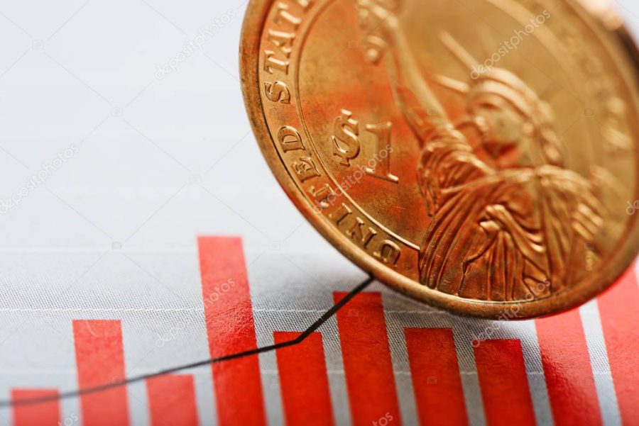 dollar coin on fluctuating graph