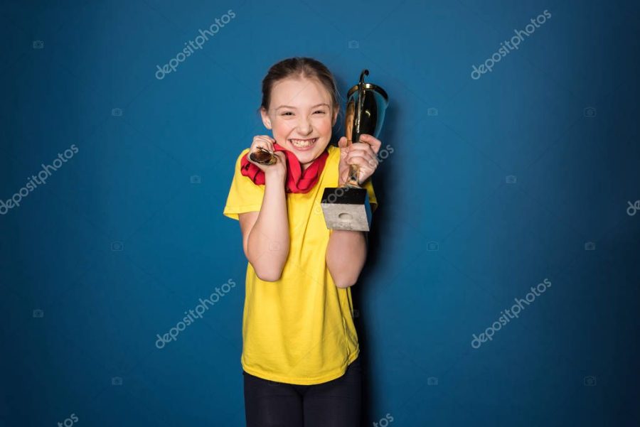 girl with medals and trophy