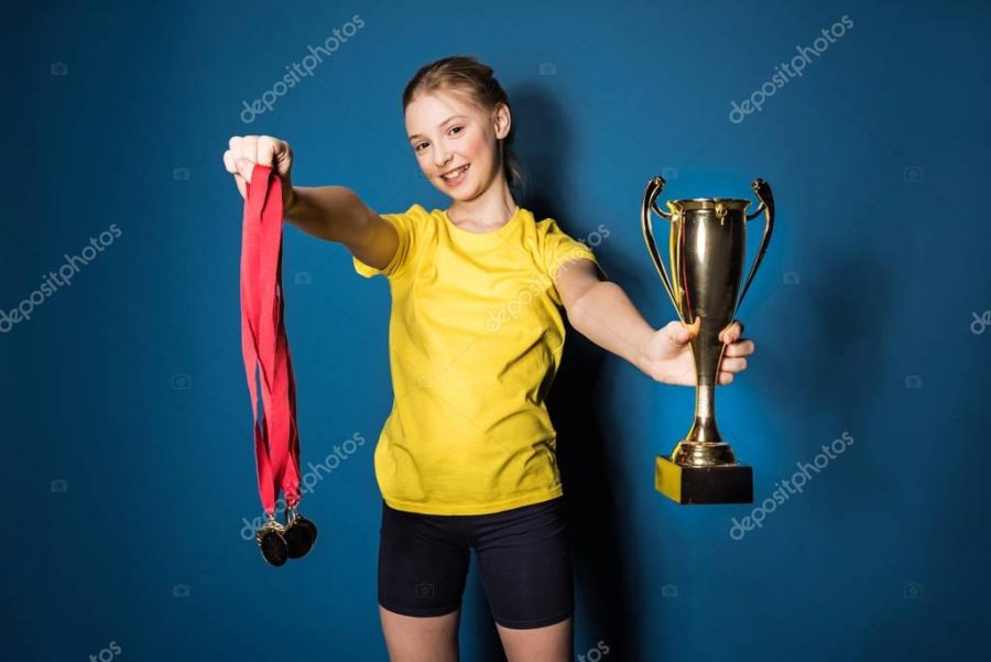 girl with medals and trophy