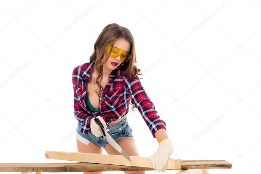 sexy girl in goggles working with saw, isolated on white