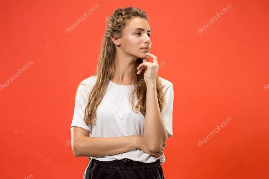 Young serious thoughtful woman. Doubt concept.