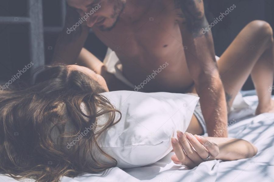 couple making love in bed