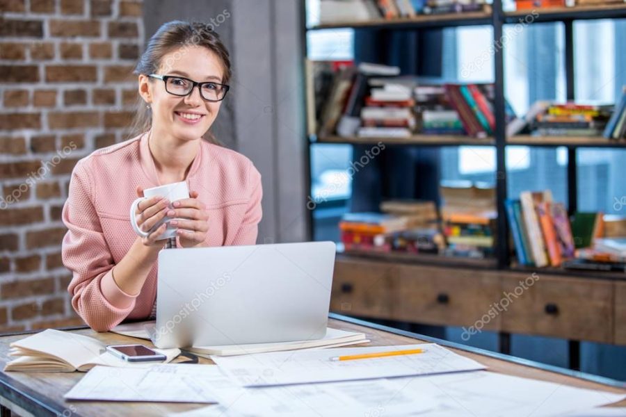 Woman holding cup of tea