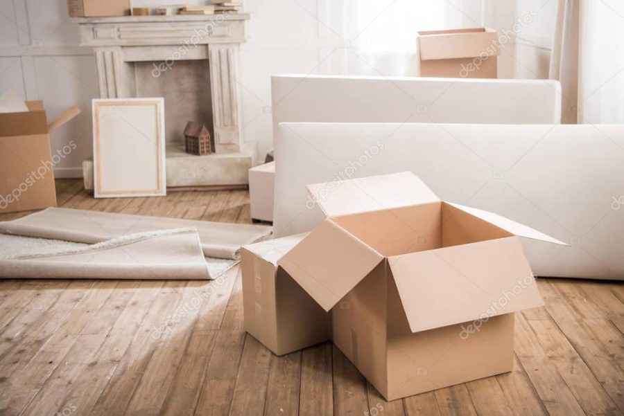 Cardboard boxes in empty room