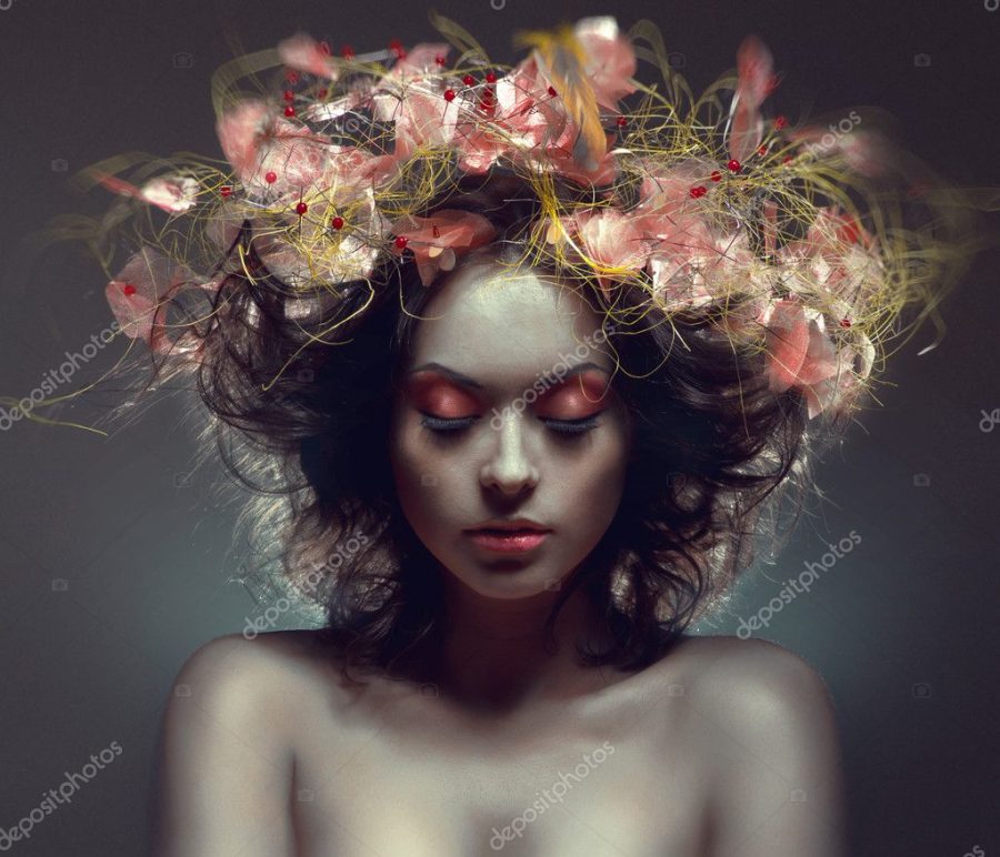 Creative beauty portrait with pink wraith in hair