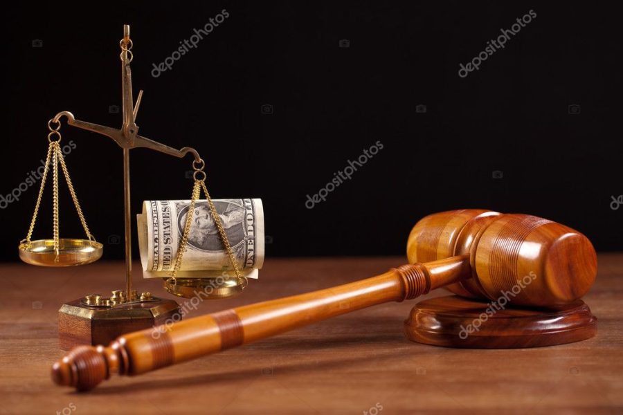 Judge gavel book and corruption money