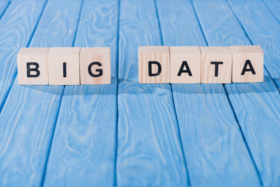 close up view of arranged wooden blocks into big data phrase on blue wooden surface