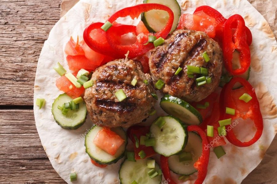 Meatballs with fresh vegetables and Flatbread close-up. Horizont