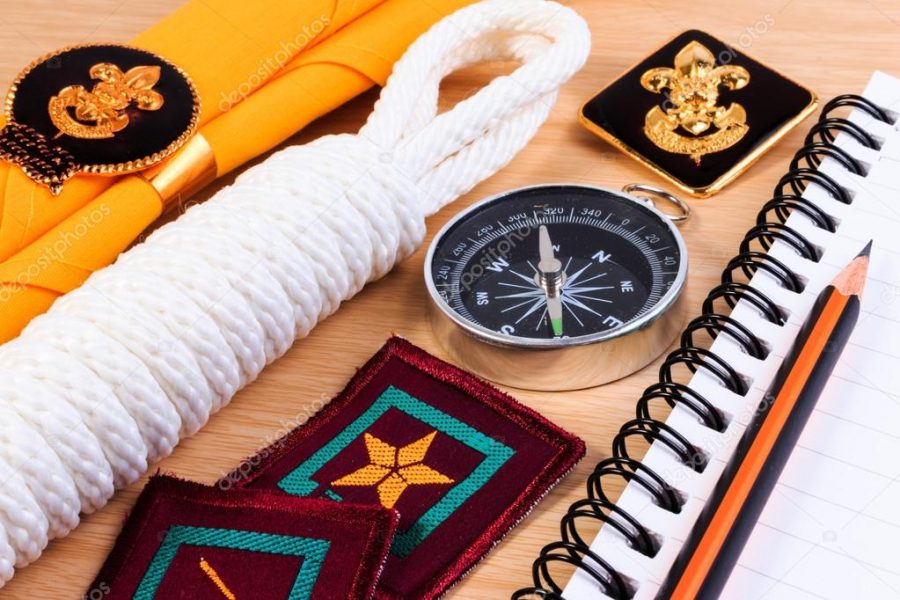 Packing checklists for scout camping trips, trip vacation, mock up close-up on wooden table.