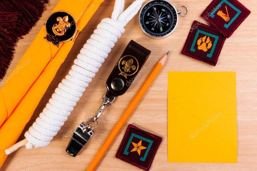 Packing checklists for scout camping trips, trip vacation, mock up close-up on wooden table.