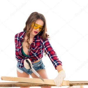 sexy girl in goggles working with saw, isolated on white