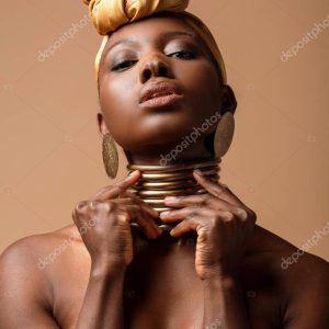 sexy naked tribal afro woman posing isolated on beige