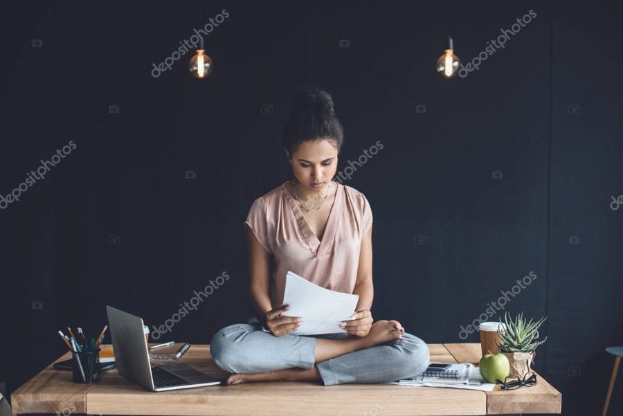 african american businesswoman doing paperwork