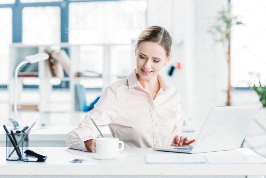 businesswoman working on laptop at office