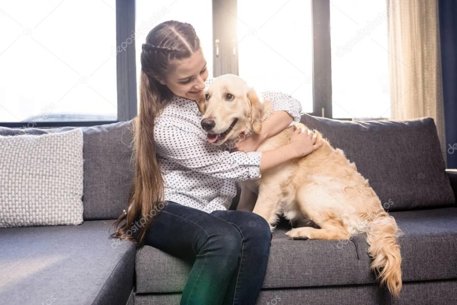 girl hugging dog