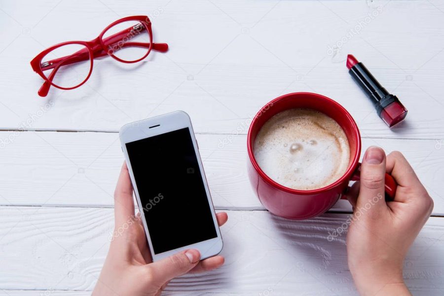 hand holding cup of coffee