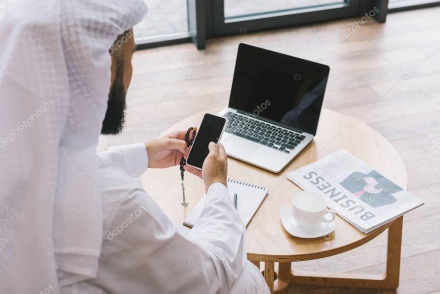 muslim businessman using smartphone