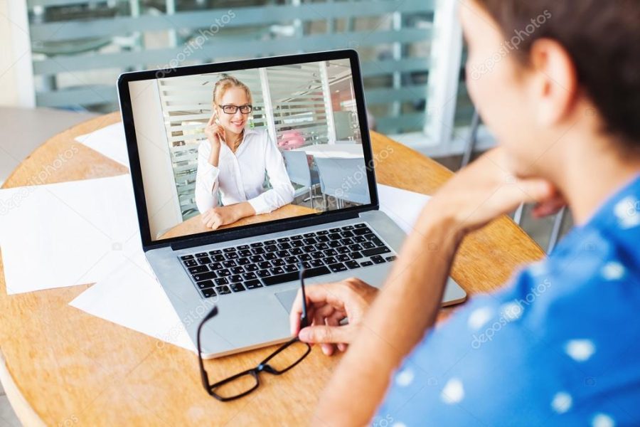 woman and man talking on web camera