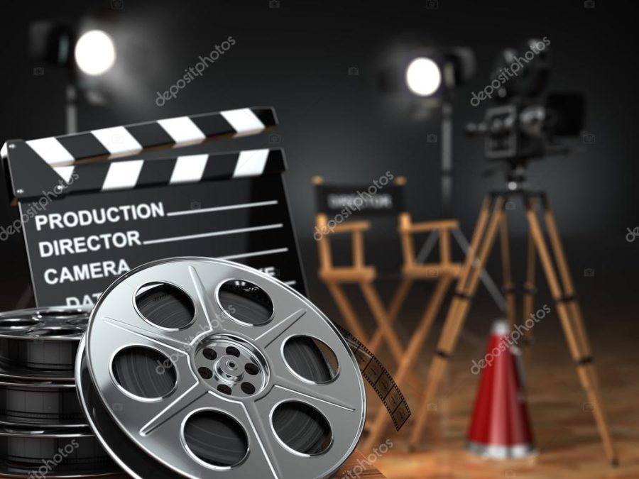 Video, movie, cinema concept. Retro camera, reels, clapperboard