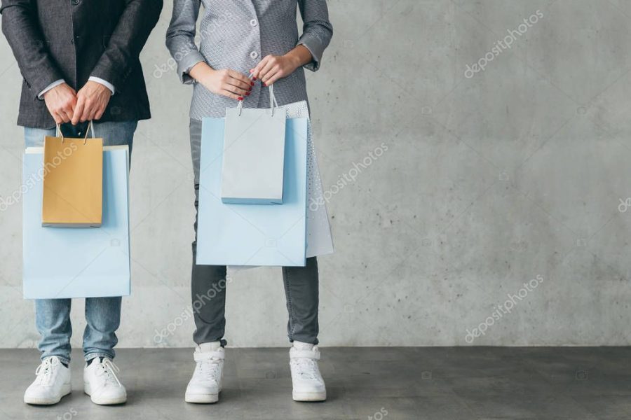 shopping store discount sale couple holding bags