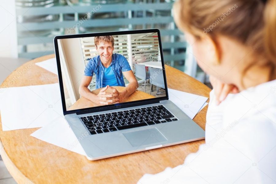 woman and man talking on web camera