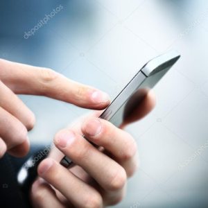 Close up of a man using mobile smart phone
