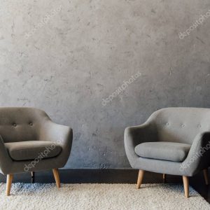 Grey armchairs on carpet