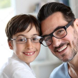 Portrait of young boy with daddy with eyeglasses on