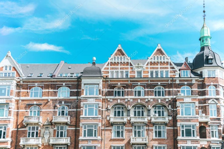 urban scene with beautiful architecture of copenhagen and cloudy sky, denmark