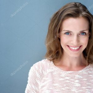Beautiful older woman smiling with sweater