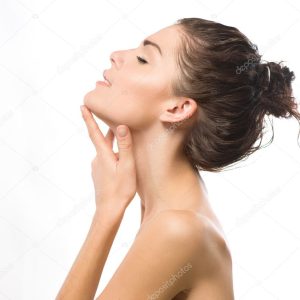 Beauty Portrait. Beautiful Spa Girl Touching her Face