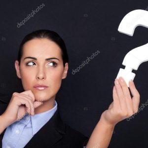 Businesswoman holding a question mark