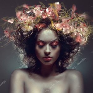 Creative beauty portrait with pink wraith in hair