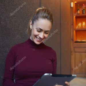 beautiful woman working on digital tablet